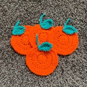 Handmade. Crochet coaster orange figure.